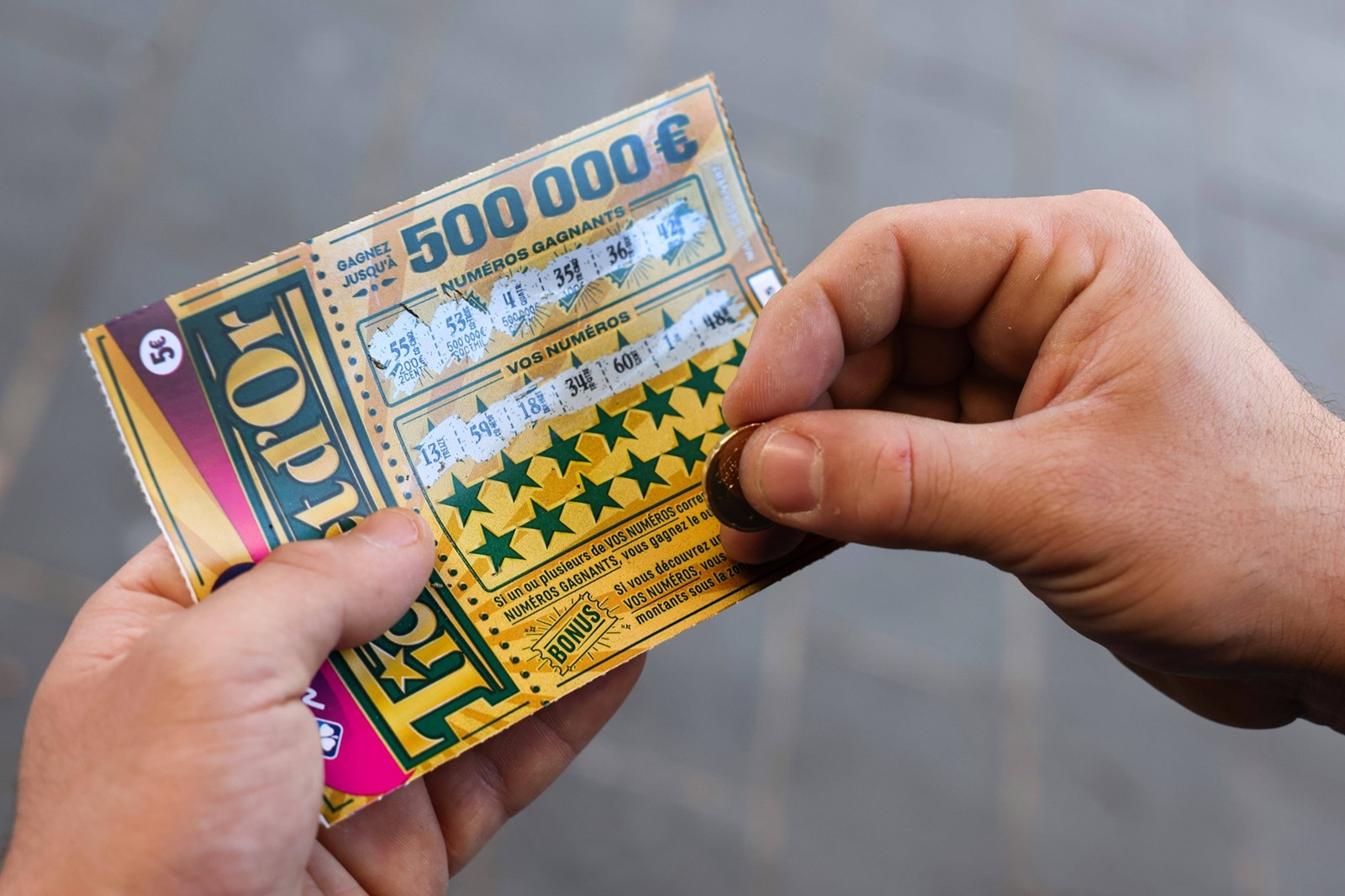 Nouveau jeu a gratter de la Francaise des Jeux "Ticket d Or" depuis janvier 2024, pour gagner jusqu a 500 000 euros. Disponible a l achat dans les points de vente physiques ou en ligne sur le site de la FDJ. Tabac, Nice FRANCE - 16/01/2024//SYSPEO_sysA009/Credit:SYSPEO/SIPA/2401161539,Image: 837637729, License: Rights-managed, Restrictions: , Model Release: no, Credit line: SYSPEO / Sipa Press / Profimedia