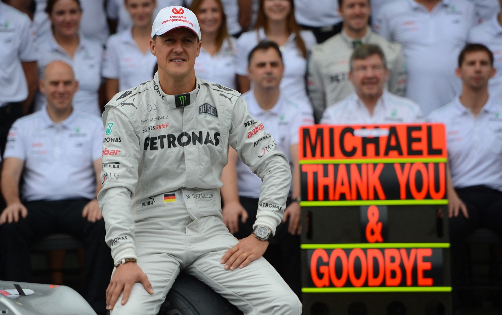 German Formula One driver Michael Schumacher poses with the Mercedes team in the pits on November 25, 2012 at the Interlagos speedway in Sao Paulo, Brazil.  Schumacher will retire from the F-1 after the Brazilain frand prix.       AFP  PHOTO / YASUYOSHI CHIBA / POOL,Image: 146747276, License: Rights-managed, Restrictions: , Model Release: no, Credit line: YASUYOSHI CHIBA / AFP / Profimedia