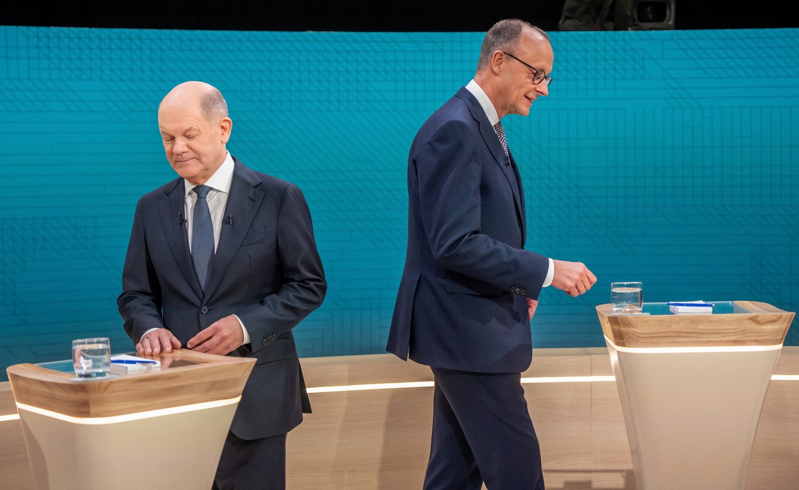 German Chancellor Olaf Scholz (L), main candidate for the Social Democratic Party (SPD), and Friedrich Merz, main candidate and chairman of the Christian Democratic Union (CDU) take up their positions prior to the TV debate joint hosted by public broadcasters ARD and ZDF in Berlin on February 9, 2025, ahead of parliamentary elections due to take place on February 23, 2025.,Image: 961634159, License: Rights-managed, Restrictions: ALTERNATE CROP, Model Release: no, Credit line: Michael Kappeler / AFP / Profimedia