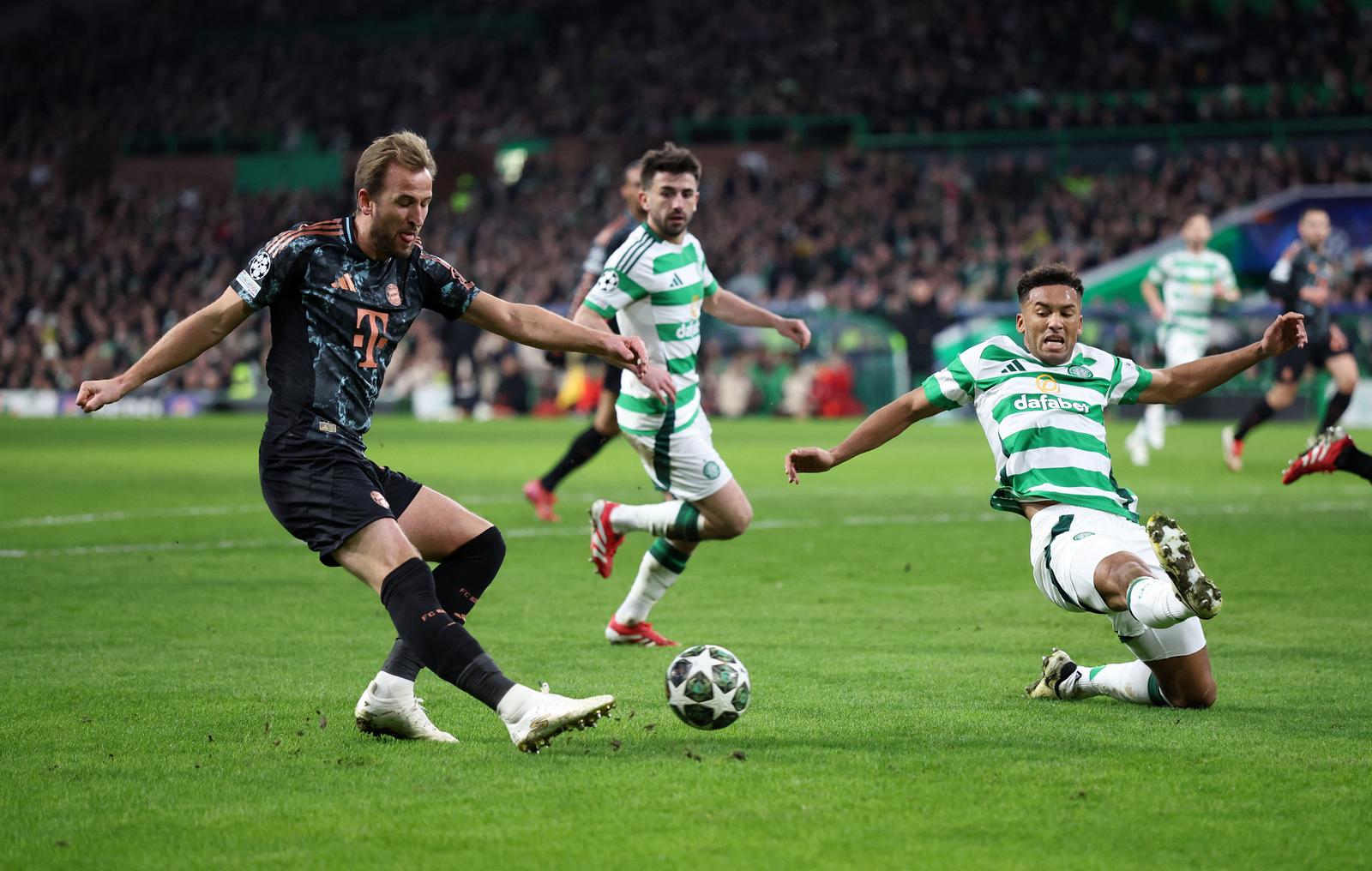 Soccer Football - Champions League - Knockout Phase Playoff - First Leg - Celtic v Bayern Munich - Celtic Park, Glasgow, Scotland, Britain - February 12, 2025 Bayern Munich's Harry Kane in action with Celtic's Auston Trusty REUTERS/Russell Cheyne Photo: RUSSELL CHEYNE/REUTERS