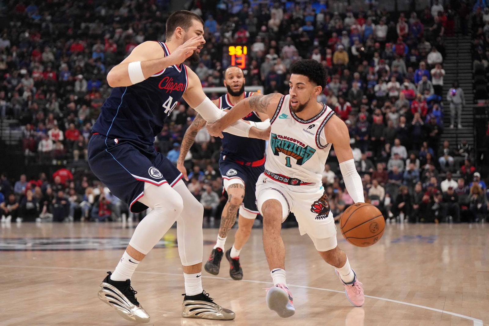 Feb 12, 2025; Inglewood, California, USA; Memphis Grizzlies guard Scotty Pippen Jr. (1) dribbles against LA Clippers center Ivica Zubac (40) in the first half at Intuit Dome. Mandatory Credit: Kirby Lee-Imagn Images Photo: Kirby Lee/REUTERS
