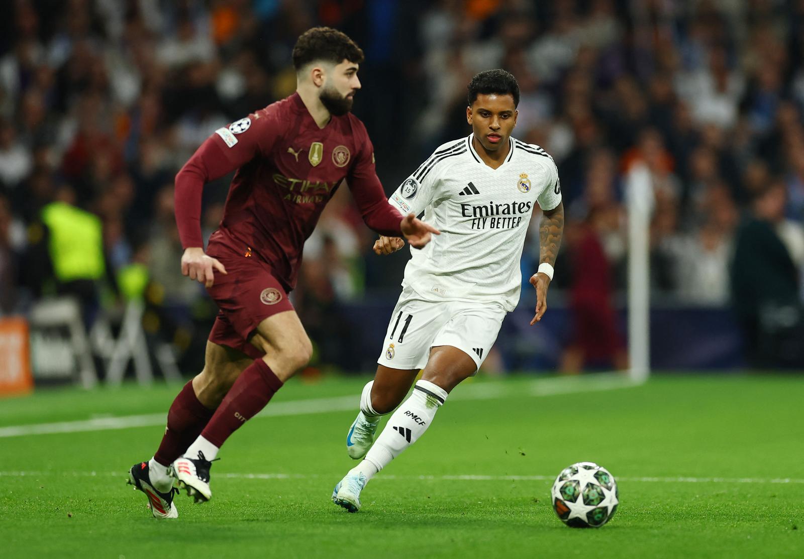 Soccer Football - Champions League - Knockout Phase Playoff - Second Leg - Real Madrid v Manchester City - Santiago Bernabeu, Madrid, Spain - February 19, 2025 Manchester City's Josko Gvardiol in action with Real Madrid's Rodrygo Action Images via Reuters/Matthew Childs Photo: Matthew Childs/REUTERS