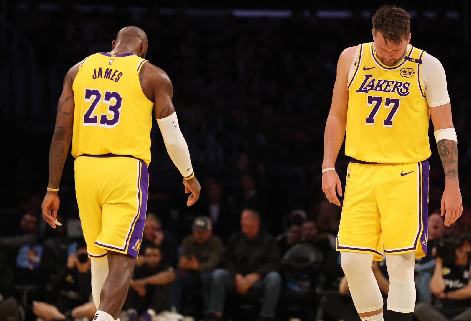 Feb 19, 2025; Los Angeles, California, USA; Los Angeles Lakers forward LeBron James (23) and guard Luka Doncic (77) during the first quarter against the Charlotte Hornets at Crypto.com Arena. Mandatory Credit: Jason Parkhurst-Imagn Images Photo: Jason Parkhurst/REUTERS