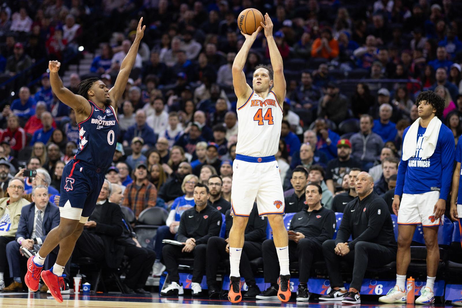 Feb 22, 2024; Philadelphia, Pennsylvania, USA; New York Knicks forward Bojan Bogdanovic (44) scores a three pointer in front of Philadelphia 76ers guard Tyrese Maxey (0) during the second quarter at Wells Fargo Center. Mandatory Credit: Bill Streicher-USA TODAY Sports Photo: Bill Streicher/REUTERS