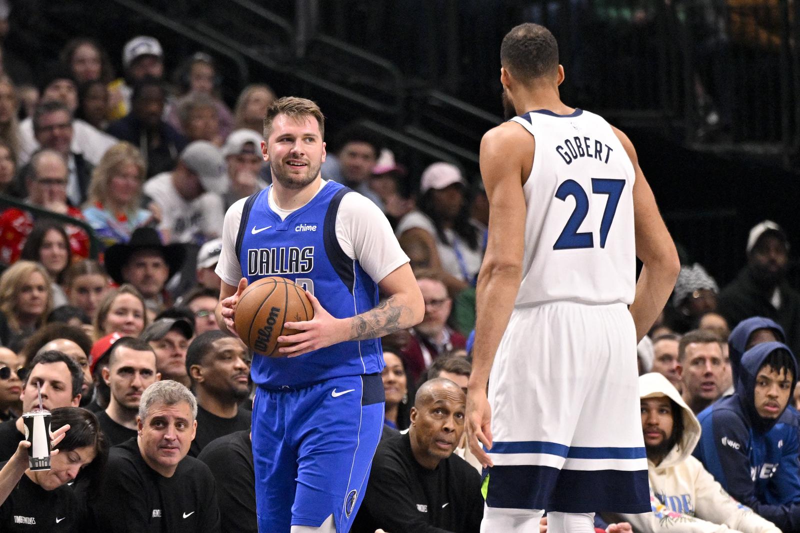 Dec 25, 2024; Dallas, Texas, USA; Dallas Mavericks guard Luka Doncic (77) exchanges words with Minnesota Timberwolves center Rudy Gobert (27) during the first quarter at the American Airlines Center. Mandatory Credit: Jerome Miron-Imagn Images Photo: Jerome Miron/REUTERS