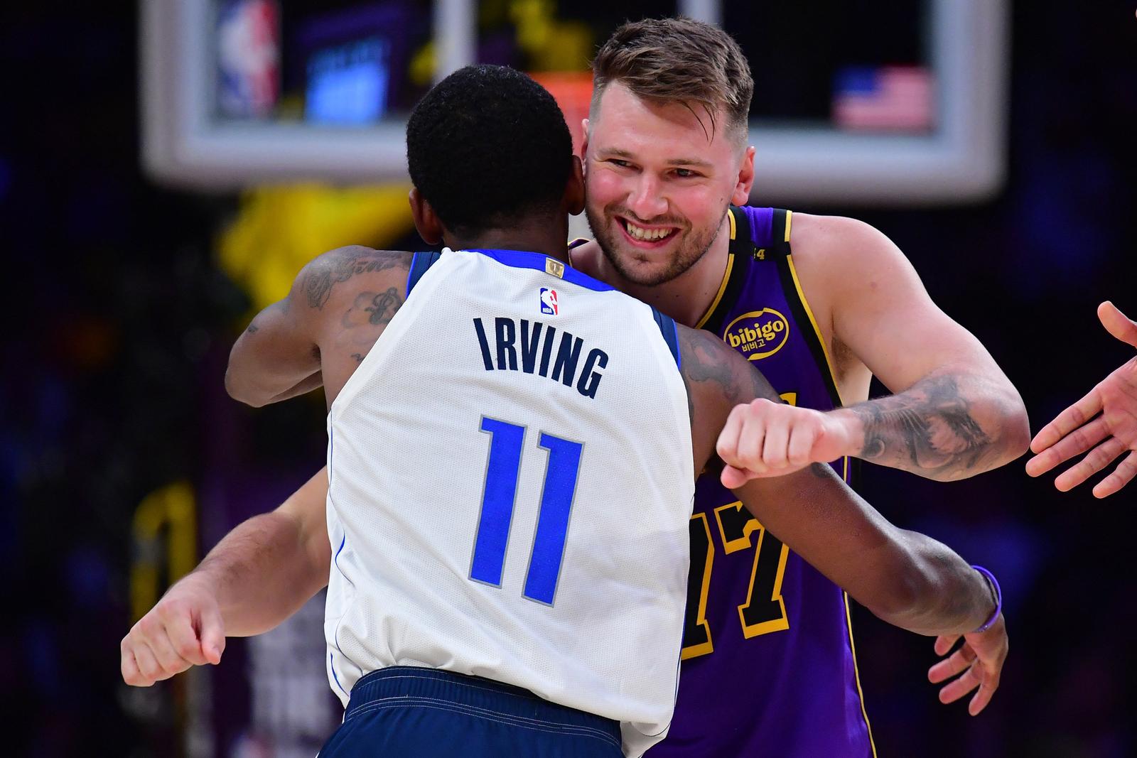 Feb 25, 2025; Los Angeles, California, USA; Los Angeles Lakers guard Luka Doncic (77) reacts with Dallas Mavericks guard Kyrie Irving (11) during the first quarter at Crypto.com Arena. Mandatory Credit: Gary A. Vasquez-Imagn Images Photo: Gary A. Vasquez/REUTERS