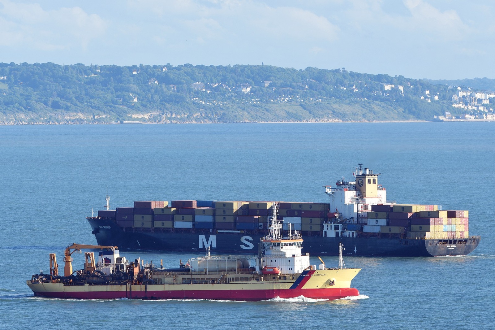 A photograph shows French Cyprus hooper dredger Samuel de Champlain (front), leaving the harbour entrance channel of Le Havre, western France, next to the Panama Container Ship MSC Monic, on May 24, 2022.,Image: 695049205, License: Rights-managed, Restrictions: , Model Release: no, Credit line: Jean-Francois MONIER / AFP / Profimedia