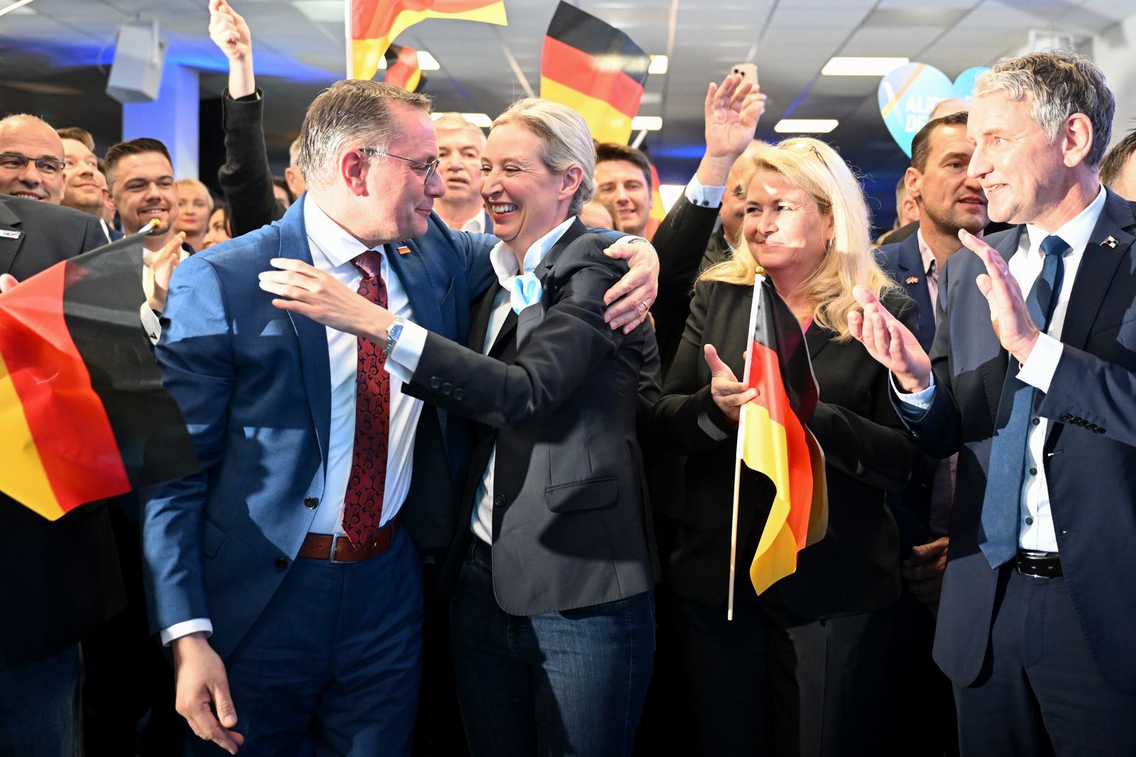 epa11918944 Alternative for Germany (AfD) party and faction co-chairwoman and top candidate for the federal election, Alice Weidel (C) reacts to initial results next to AfD co-chairman Tino Chrupalla (L) during the party's election event at its headquarters in Berlin, Germany, 23 February 2025. About 60 million Germans were eligible to vote in the elections for a new federal parliament (Bundestag).  EPA/SOEREN STACHE / POOL Stadt aktualisiert