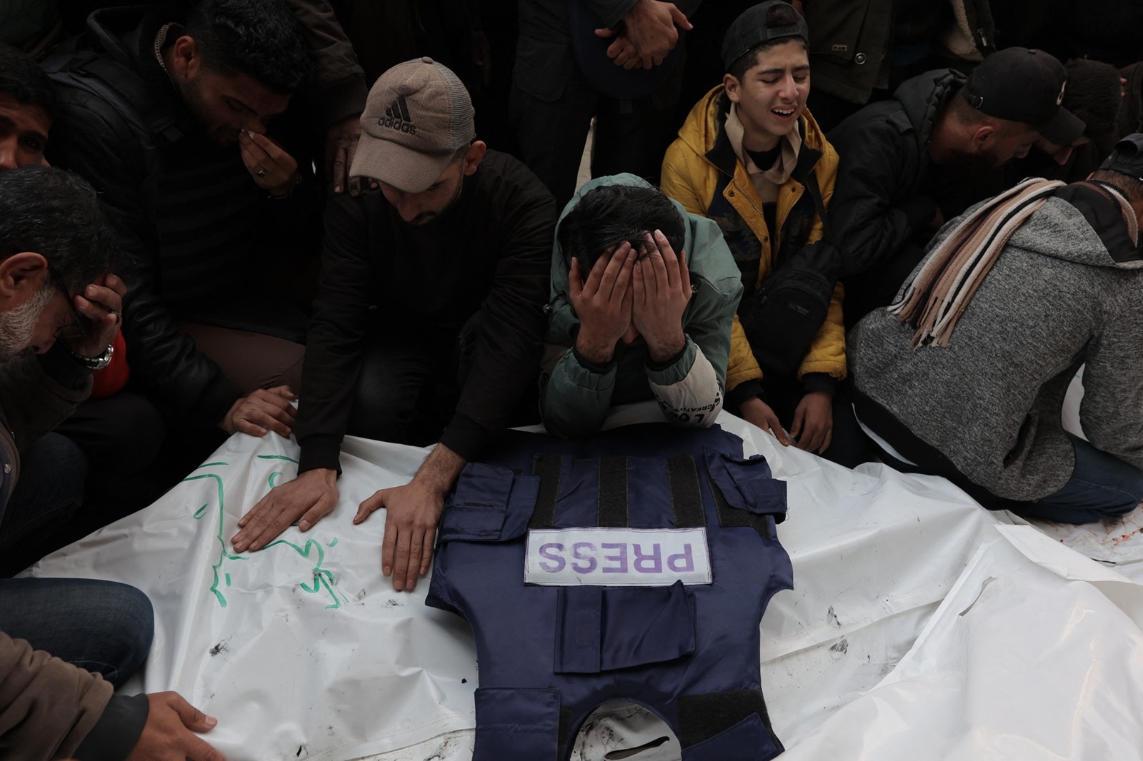 GAZA CITY, GAZA - DECEMBER 26: Relatives of 5 photojournalists Ayman al-Jedy and journalists Faisal Abu Al Qumsan, Ibrahim Sheikh Ali, Mohammad Al-Lada and Fadi Hassouna, who lost their lives after Israeli forces hit the live broadcasting vehicle belonging to Al-Quds al-Youm television (alqudstoday-tv) at the Nuseirat Refugee Camp, mourn over the dead bodies over them at Al Awda Hospital in Gaza City, Gaza on December 26, 2024. Hassan Jedi / Anadolu,Image: 950155204, License: Rights-managed, Restrictions: , Model Release: no, Credit line: Hassan Jedi / AFP / Profimedia