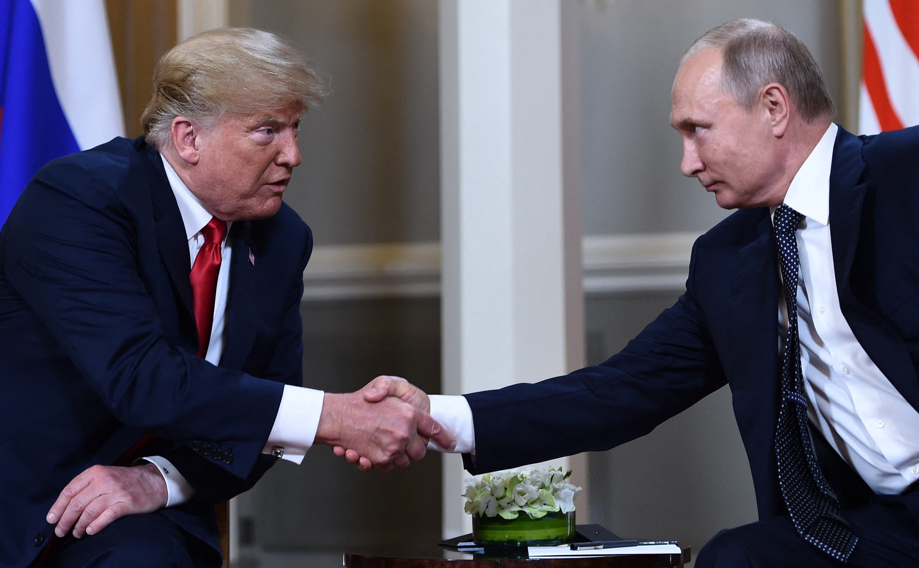 Russian President Vladimir Putin (R) and US President Donald Trump shake hands before a meeting in Helsinki, on July 16, 2018.,Image: 377998472, License: Rights-managed, Restrictions: , Model Release: no, Credit line: Brendan Smialowski / AFP / Profimedia