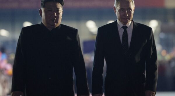 In this pool photograph distributed by the Russian state agency Sputnik, Russian President Vladimir Putin (R) and North Korean leader Kim Jong Un walk during a farewell ceremony upon Putin's departure at the Sunan International Airport in Pyongyang on June 19, 2024.  Putin enjoyed a red carpet welcome, a military ceremony and an embrace from North Korea's Kim Jong Un during a state visit to Pyongyang where they both pledged to forge closer ties.,Image: 883157801, License: Rights-managed, Restrictions: -- Editor's note : this image is distributed by the Russian state owned agency Sputnik --, Model Release: no, Credit line: Vladimir Smirnov / AFP / Profimedia