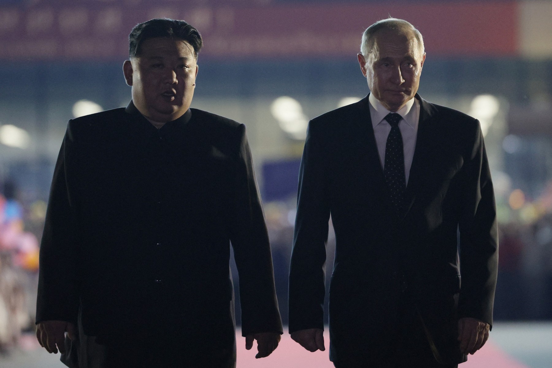 In this pool photograph distributed by the Russian state agency Sputnik, Russian President Vladimir Putin (R) and North Korean leader Kim Jong Un walk during a farewell ceremony upon Putin's departure at the Sunan International Airport in Pyongyang on June 19, 2024.  Putin enjoyed a red carpet welcome, a military ceremony and an embrace from North Korea's Kim Jong Un during a state visit to Pyongyang where they both pledged to forge closer ties.,Image: 883157801, License: Rights-managed, Restrictions: -- Editor's note : this image is distributed by the Russian state owned agency Sputnik --, Model Release: no, Credit line: Vladimir Smirnov / AFP / Profimedia
