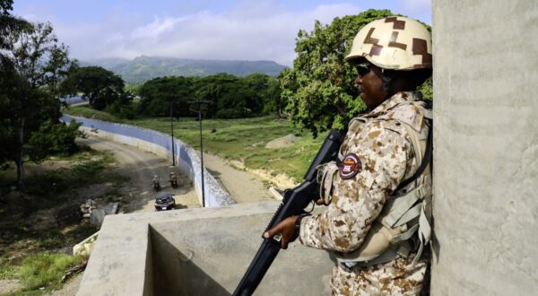 A Dominican Republic soldier stands guard at the border wall built along the Dominican Republic-Haiti border in Pedernales, Dominican Republic, on June 20, 2024.,Image: 883416382, License: Rights-managed, Restrictions: , Model Release: no, Credit line: Erickson POLANCO / AFP / Profimedia