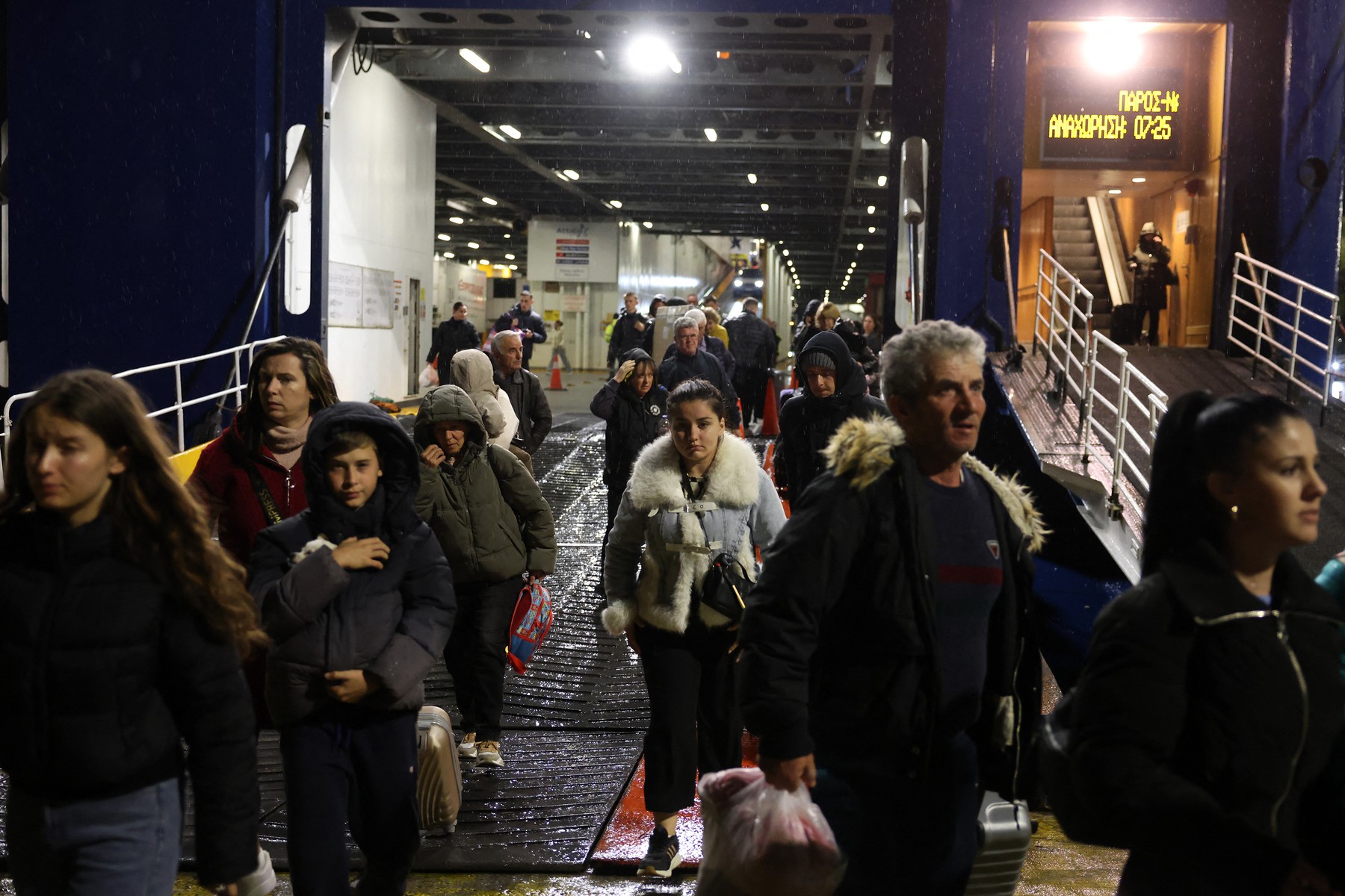 PIRAEUS, GREECE - FEBRUARY 04: People fleeing Santorini island disembark a ferry at the port of Piraeus as earthquake swarm worries Greek experts, in Piraeus, Greece, on February 3, 2025. Costas Baltas / Anadolu/ABACAPRESS.COM,Image: 959976087, License: Rights-managed, Restrictions: , Model Release: no, Credit line: AA/ABACA / Abaca Press / Profimedia