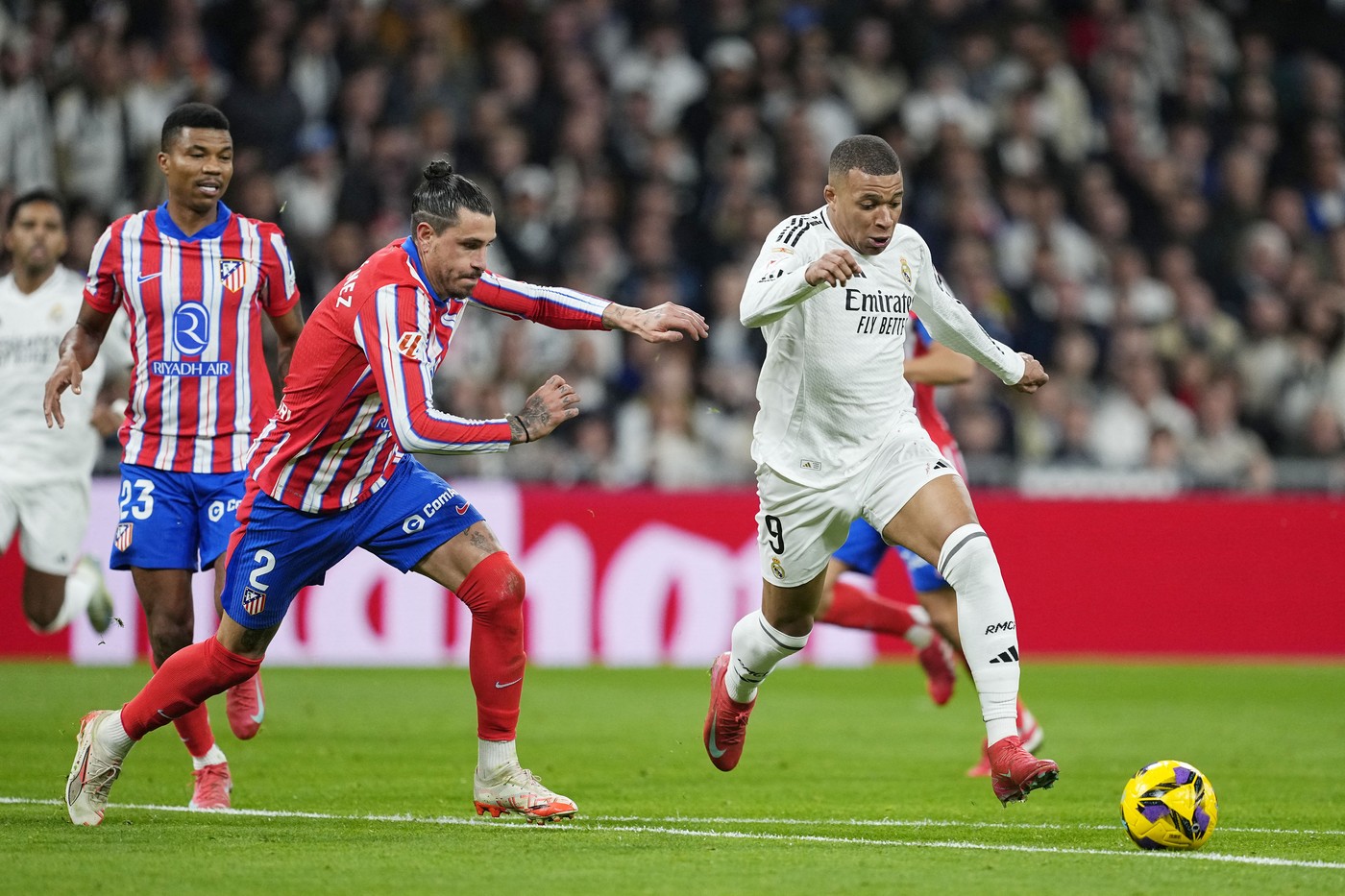 Kylian Mbappe of Real Madrid and Jose Maria Gimenez of Atletico de Madrid during the Spanish championship La Liga football match between Real Madrid and Atletico de Madrid on February 8, 2025 at Santiago Bernabeu stadium in Madrid, Spain - Photo Oscar J Barroso / Spain DPPI / DPPI,Image: 961509417, License: Rights-managed, Restrictions: Hungary Out, Model Release: no, Credit line: Oscar Barroso / AFP / Profimedia