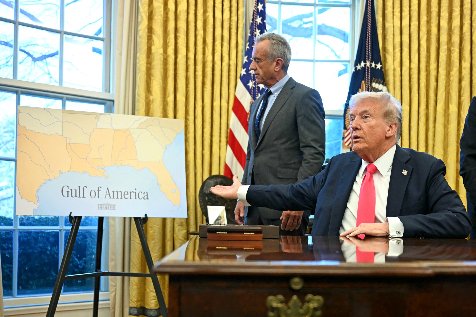 US President Donald Trump points a a map reading "Gulf of America" as he speaks to the press after signing an Executive Order, alongside US Secretary of Health and Human Services Robert F. Kennedy Jr. (L), at the Oval Office of the White House in Washington, DC on February 25, 2025. Trump signed an executive order on price transparency requirements on the health care industry to reinstate and strengthen them. He also signed an order on the supply of copper and foreign copper in the American market, the order charges Lutnick with looking at process to potentially impose tariffs or trade barriers.,Image: 968841888, License: Rights-managed, Restrictions: , Model Release: no, Credit line: Jim WATSON / AFP / Profimedia