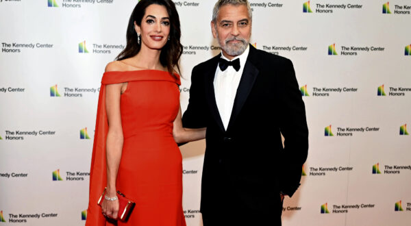 2022 Kennedy Center Honoree actor George Clooney and his wife, Amal Clooney, arrive at the State Department for the Kennedy Center Honors gala dinner, Saturday, Dec. 3, 2022, in Washington. (AP Photo/Kevin Wolf)