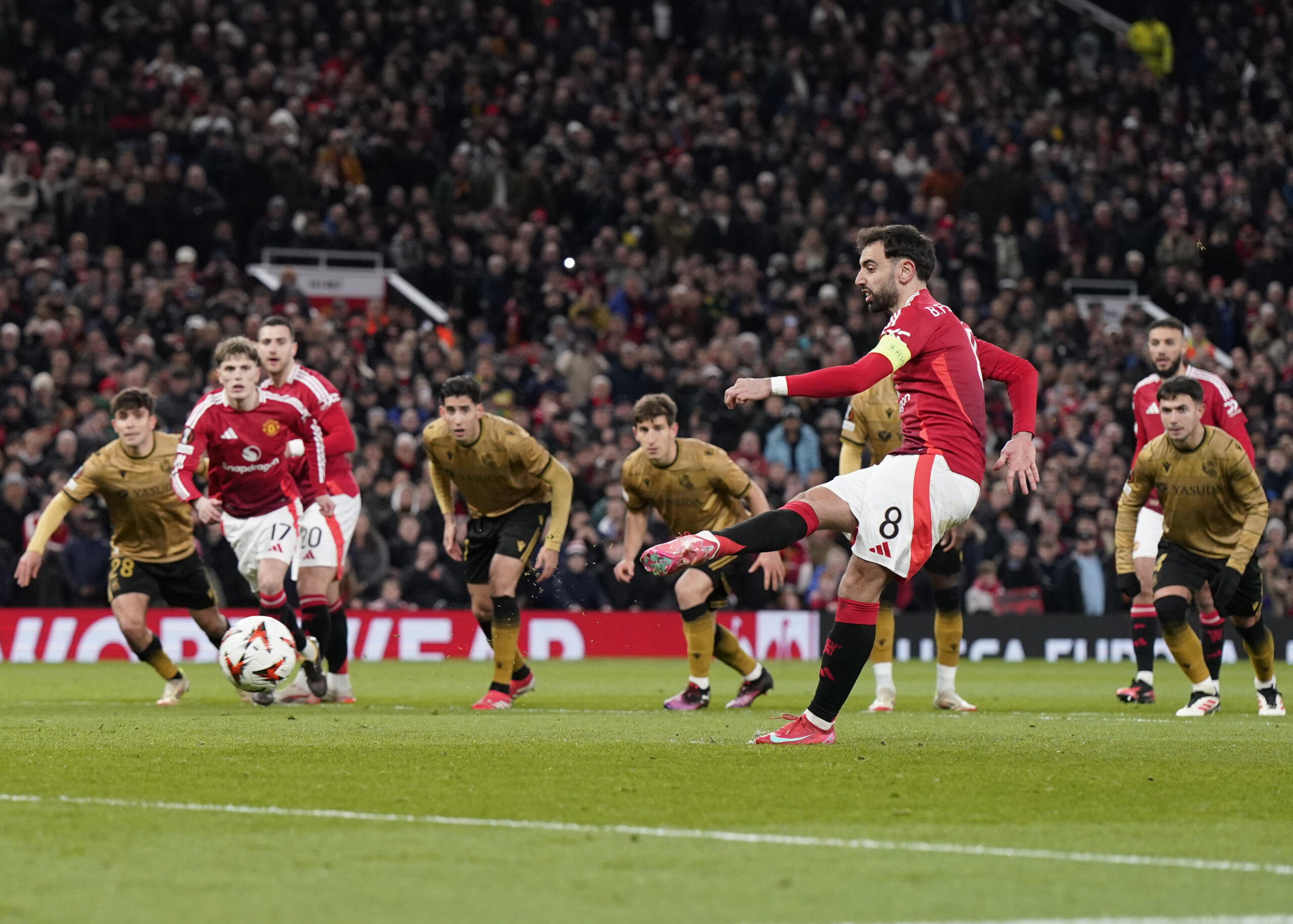 March 13, 2025, Manchester: Manchester, England, 13th March 2025. Bruno Fernandes of Manchester United scoring the equalising penalty during the UEFA Europa League match Manchester United v Real Sociedad at Old Trafford, Manchester. (Credit Image: Â© Andrew Yates/Sportimage/Cal Sport Media) (Cal Sport Media via AP Images)