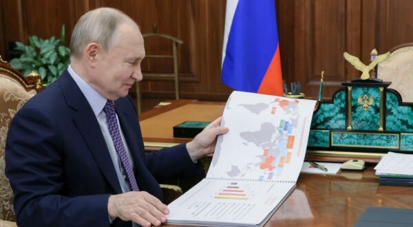 epa11923879 Russian President Vladimir Putin meets with Dream Island Holding Company Chairman of the Board Amiran Mutsoyev at the Kremlin in Moscow, Russia, 25 February 2025. During the meeting, the participants discussed the work of the Dream Island cultural and entertainment cluster in the Nagatinskaya Poima in Moscow.  EPA/GRIGORY SYSOEV / SPUTNIK / KREMLIN POOL MANDATORY CREDIT