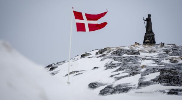 epa11953191 A view of the Dannebrog and Hans Egede Statue in Nuuk, Greenland, 09 March 2025 (issued 10 March 2025). Greenlanders are holding elections for Greenland's parliament, Inatsisartut, on 11 March 2025.  EPA/Mads Claus Rasmussen  DENMARK OUT
