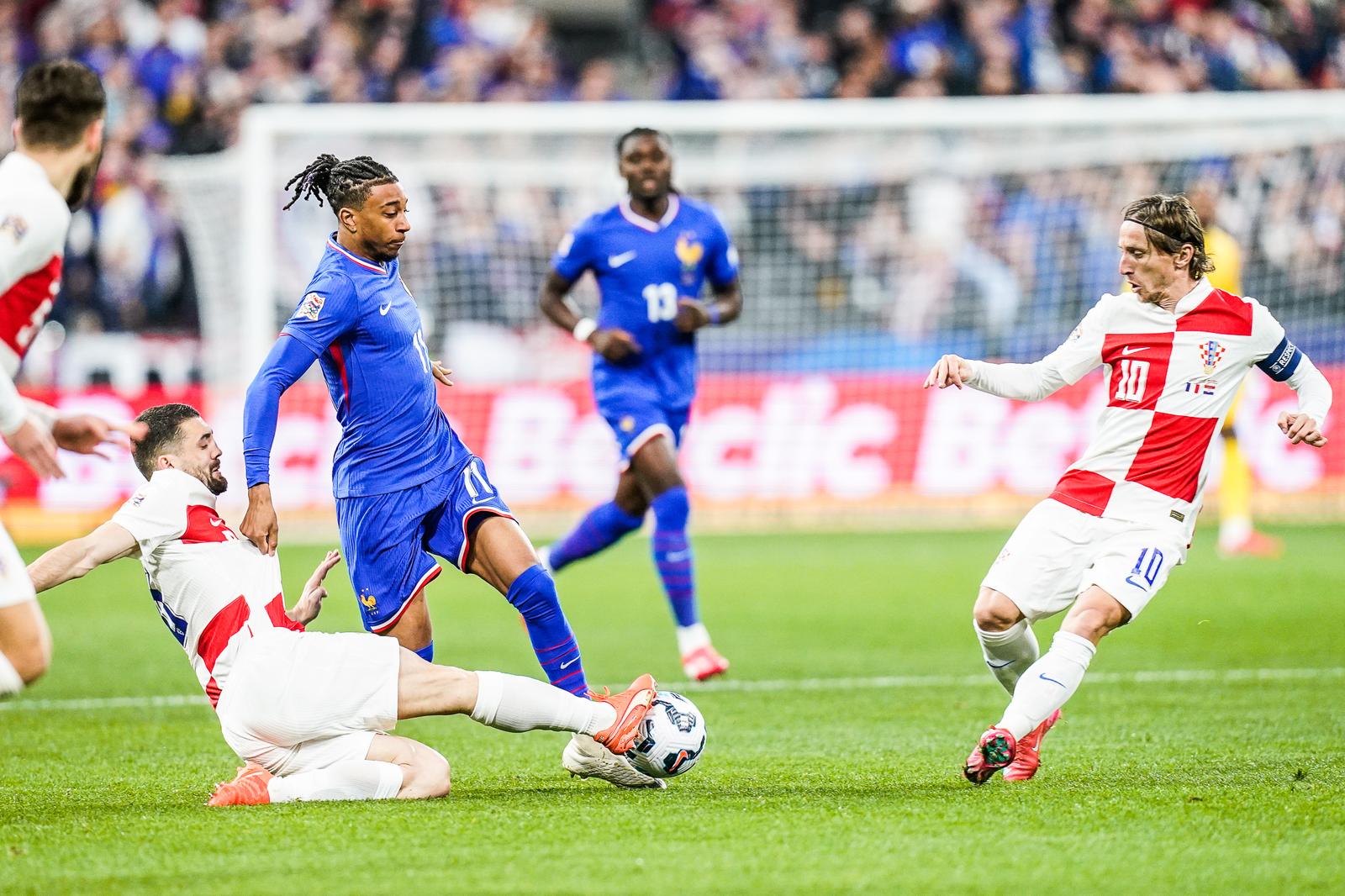 Michael OLISE of France and Luka MODRIC of Croatia during the UEFA Nations League 2024/2025 match between France and Croatia at Stade de France on March 23, 2025 in Paris, France. (Photo by Daniel Derajinski/Icon Sport) Photo: Icon Sport/ICON SPORT
