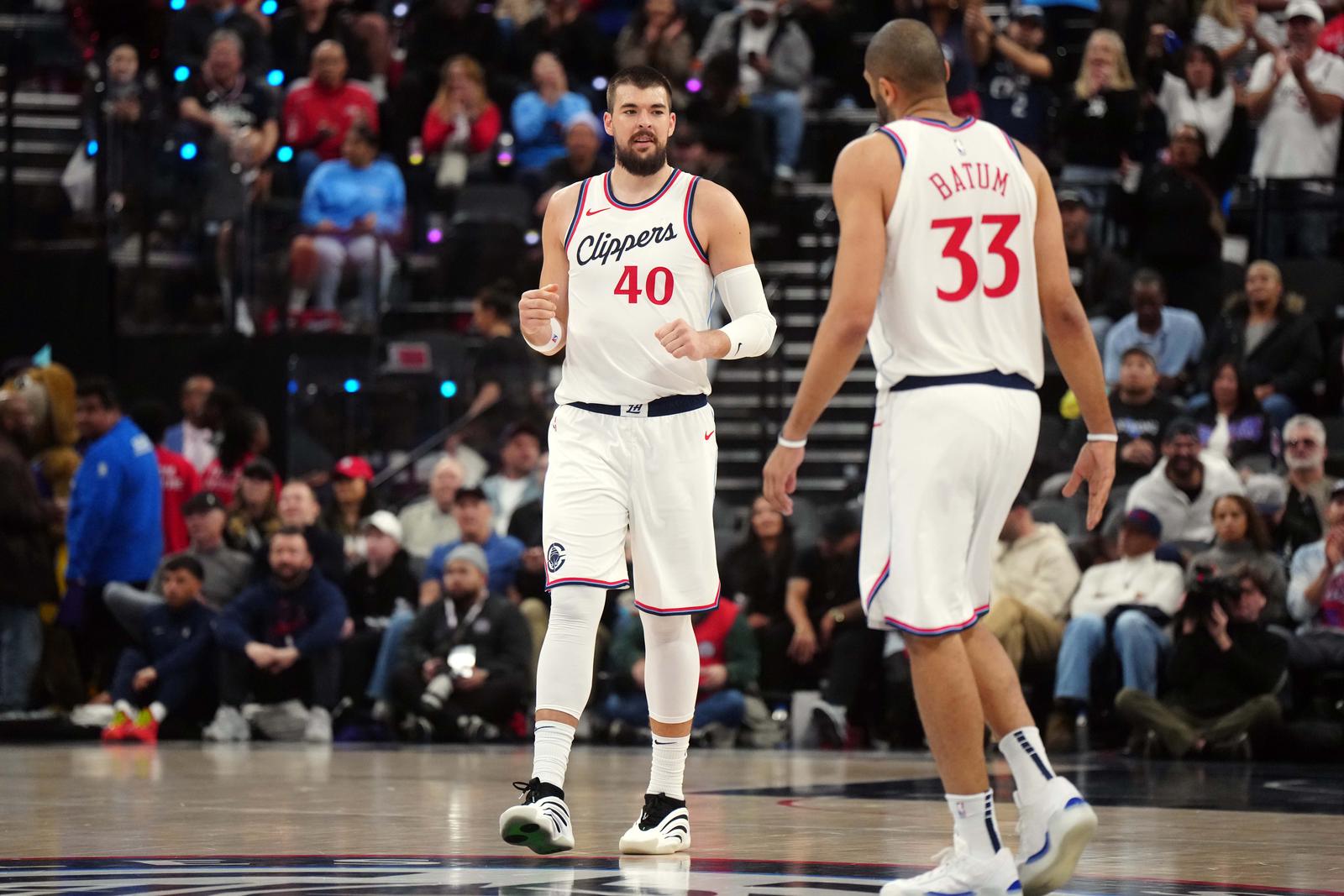Mar 9, 2025; Inglewood, California, USA; LA Clippers center Ivica Zubac (40) and forward Nicolas Batum (33) react against the Sacramento Kings in the first half at Intuit Dome. Mandatory Credit: Kirby Lee-Imagn Images/Sipa USA Photo: Imagn Images/SIPA USA