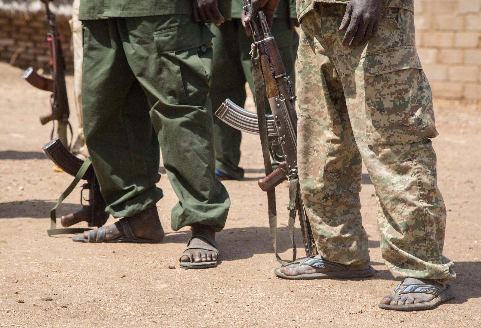 Fighters of the SPLA-N stand on a dusty road wearing sandals and holding Kalashnikov assualt rifles in Heiban, Sudan, 12 February 2017. The Nuba mountains are held by the Sudanese Liberation Army and their political branch (SPLM-N). Photo: Laura Wagenknecht/dpa /DPA/PIXSELL