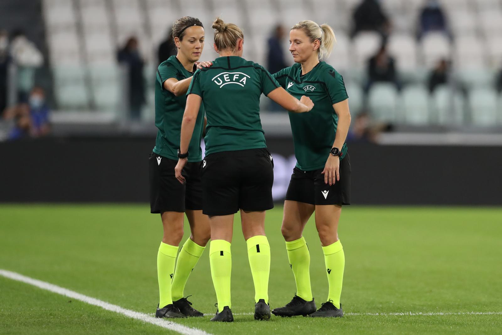 October 13, 2021, Turin, United Kingdom: Turin, Italy, 13th October 2021. The referee Ivana Martincic of Croatia stretches with her Assistants Sanja Rodak Karsic ( right ) and Maja Petravic ( centre ) during the warm up prior to the UEFA Womens Champions League match at Juventus Stadium, Turin. Picture credit should read: Jonathan Moscrop / Sportimage Photo via Newscom Photo: Jonathan Moscrop/NEWSCOM