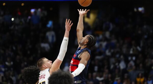 Mar 15, 2025; Denver, Colorado, USA; Denver Nuggets center Nikola Jokic (15) and Washington Wizards forward Alex Sarr (20) reach for the tip-off in the first quarter at Ball Arena. Mandatory Credit: Ron Chenoy-Imagn Images Photo: Ron Chenoy/REUTERS