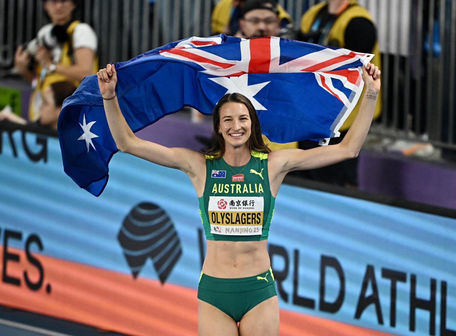 Athletics - World Athletics Indoor Championships - Nanjing Youth Olympic Sports Park, Nanjing, China - March 23, 2025 Australia's Nicola Olyslagers celebrates after winning gold in the Women's High Jump Final REUTERS/Dylan Martinez Photo: Dylan Martinez/REUTERS