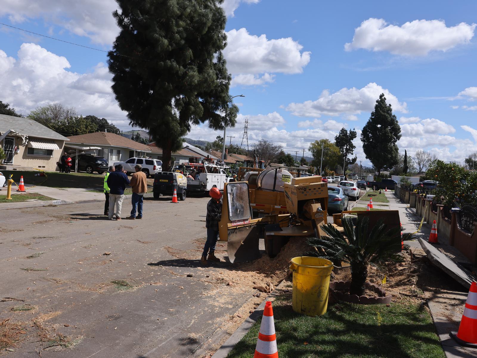 (250313) -- PICO RIVERA (U.S.), March 13, 2025 (Xinhua) -- People work on a street after a tornado in Pico Rivera, Los Angeles, California, the United States, on March 13, 2025. A tornado ripped through Los Angeles County, Southern California, early Thursday morning, the U.S. National Weather Service (NWS) confirmed. The tornado caused exterior damage to homes and cars, and snapped multiple trees, said NWS. (Photo by Qiu Chen/Xinhua) Photo: Qiu Chen/XINHUA