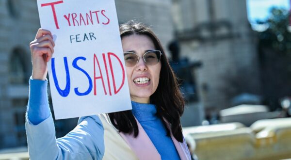 Laid-off staff exit the USAID offices as people rally in support in Washington, D.C. on Friday, February 28, 2025. Laid-off staff were given 15 minute periods on Thursday and Friday to clear out their belongings and desks. Photo by Annabelle Gordon/UPI Photo via Newscom Photo: Annabelle Gordon/NEWSCOM