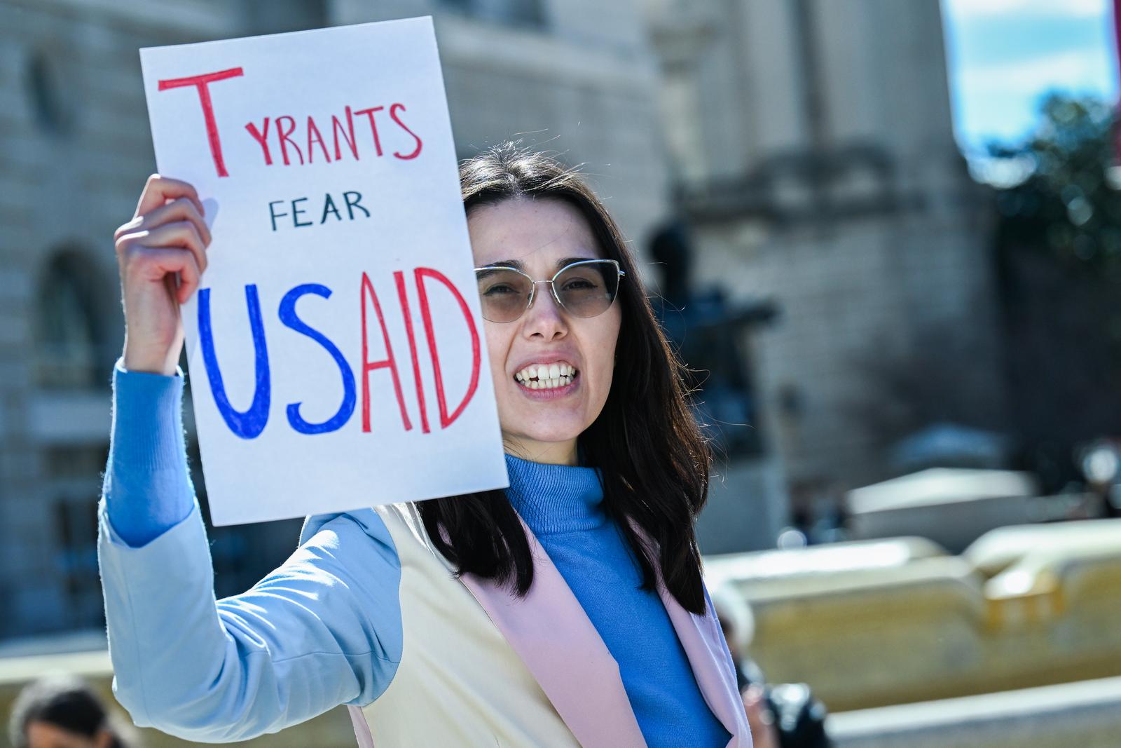 Laid-off staff exit the USAID offices as people rally in support in Washington, D.C. on Friday, February 28, 2025. Laid-off staff were given 15 minute periods on Thursday and Friday to clear out their belongings and desks. Photo by Annabelle Gordon/UPI Photo via Newscom Photo: Annabelle Gordon/NEWSCOM