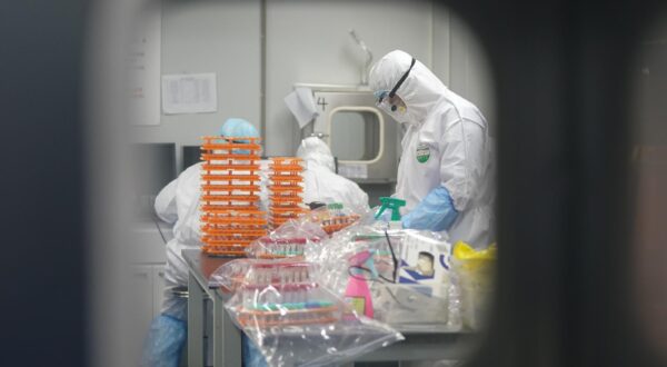 CHINA-HUBEI-WUHAN-CORONAVIRUS DETECTION LAB (CN) (200222) -- WUHAN, Feb. 22, 2020 (Xinhua) -- Staff members do nucleic acid testing work at a novel coronavirus detection lab in Wuhan, central China's Hubei Province, Feb. 22, 2020. Since its operation on Feb. 6, the novel coronavirus detection lab named "Huoyan", jointly constructed by the local government and other institutions, has tested tens of thousands of nucleic acid testing (NAT) samples. For days, including the "Huoyan" lab, Wuhan's 40 NAT institutions together, have been able to test 14,000 NAT samples per day, zeroing the number of daily NAT from all possible coronavirus patients. (Xinhua/Cheng Min) Cheng Min  Photo: XINHUA/PIXSELL