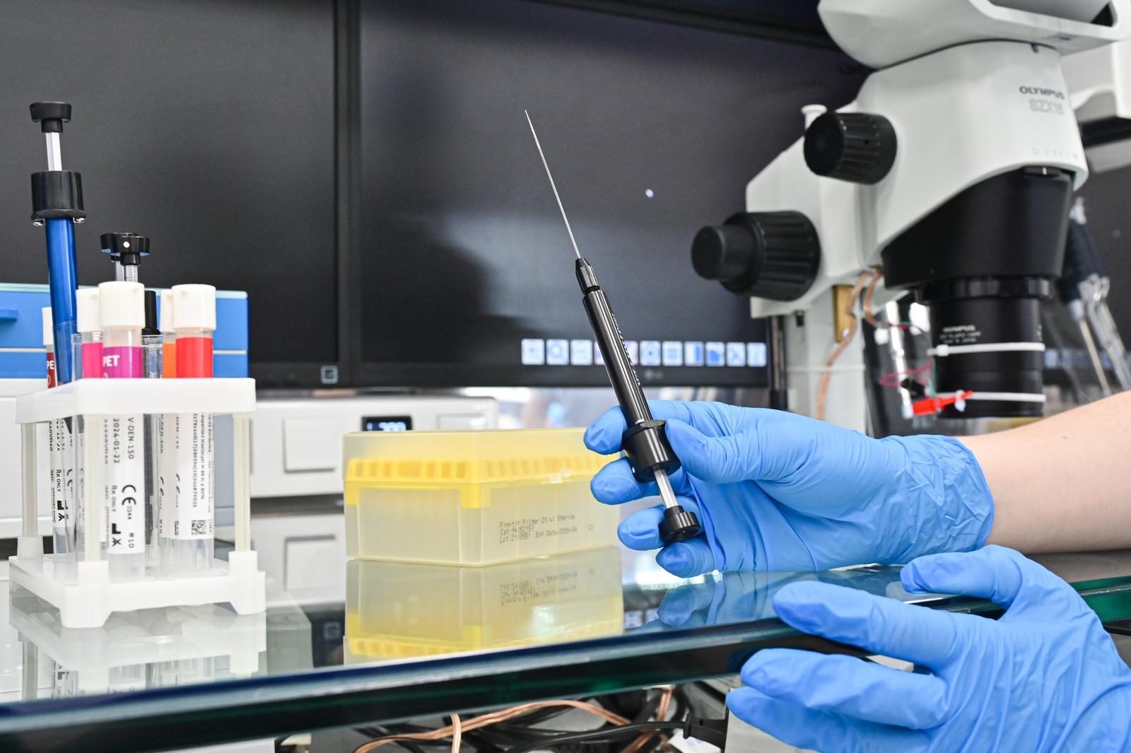 RUSSIA, KRASNODAR REGION - MARCH 10, 2025: A laboratory technician holds a syringe while cloning a cow embryo in the Altragen biotechnology lab at the Rassvet commercial dairy farm, part of the Progress Agro Group, in the village of Nekrasovskaya. Igor Onuchin/TASS/Sipa USA Photo: Tass/SIPA USA