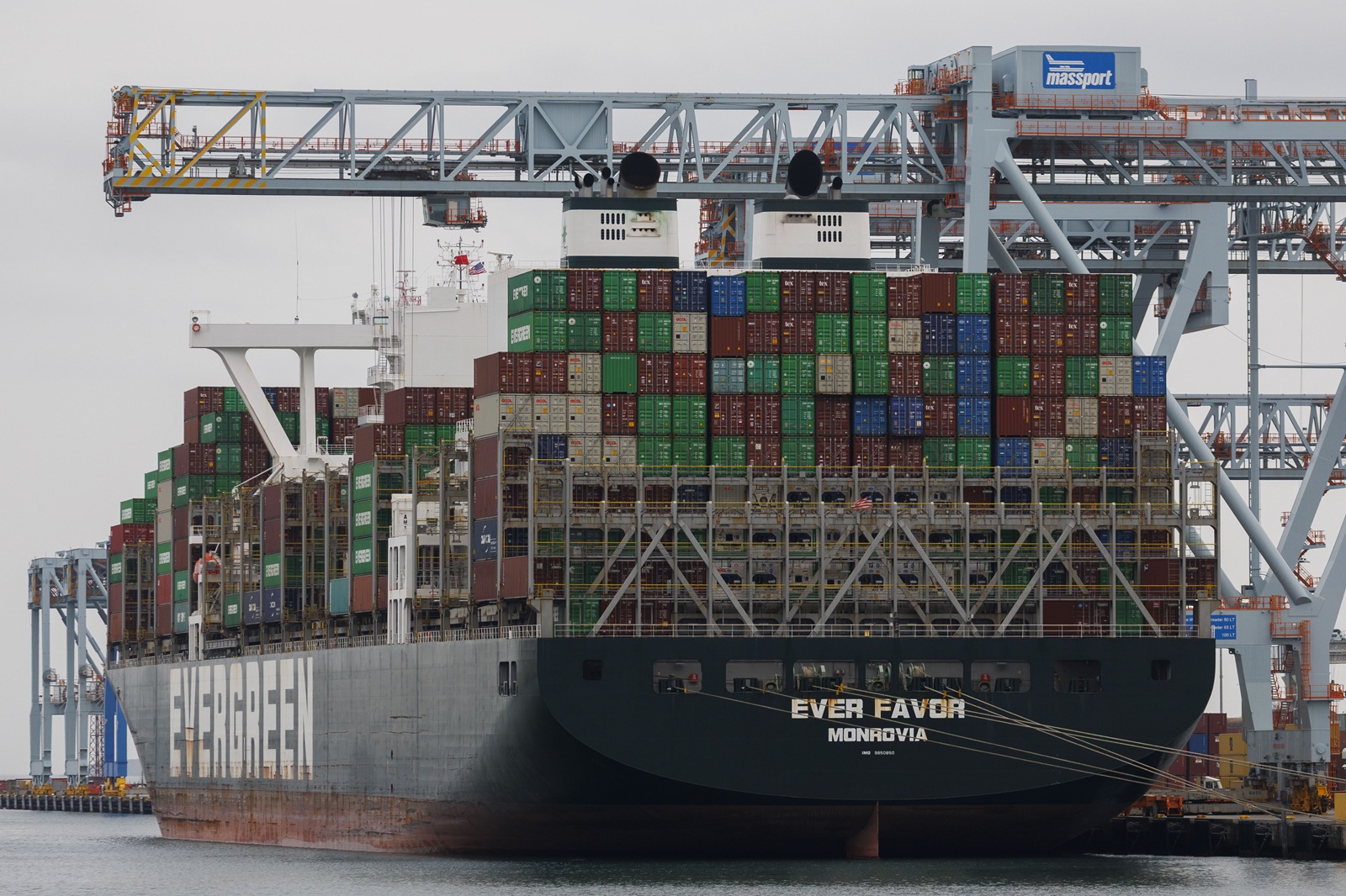 epa11928664 The container ship, Ever Favor, is unloaded at the Conley Terminal in Boston, Massachusetts, USA, 27 February 2025. US President Trump posted on social media that his proposed tariffs on Mexico and Canada will go into effect on 04 March 2025 with an additional 10 percent tariff on China.  EPA/CJ GUNTHER