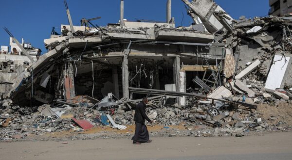epa11964439 An elderly Palestinian man walks past a destroyed building in Gaza City, northern Gaza Strip, 14 March 2025.  EPA/MOHAMMED SABER