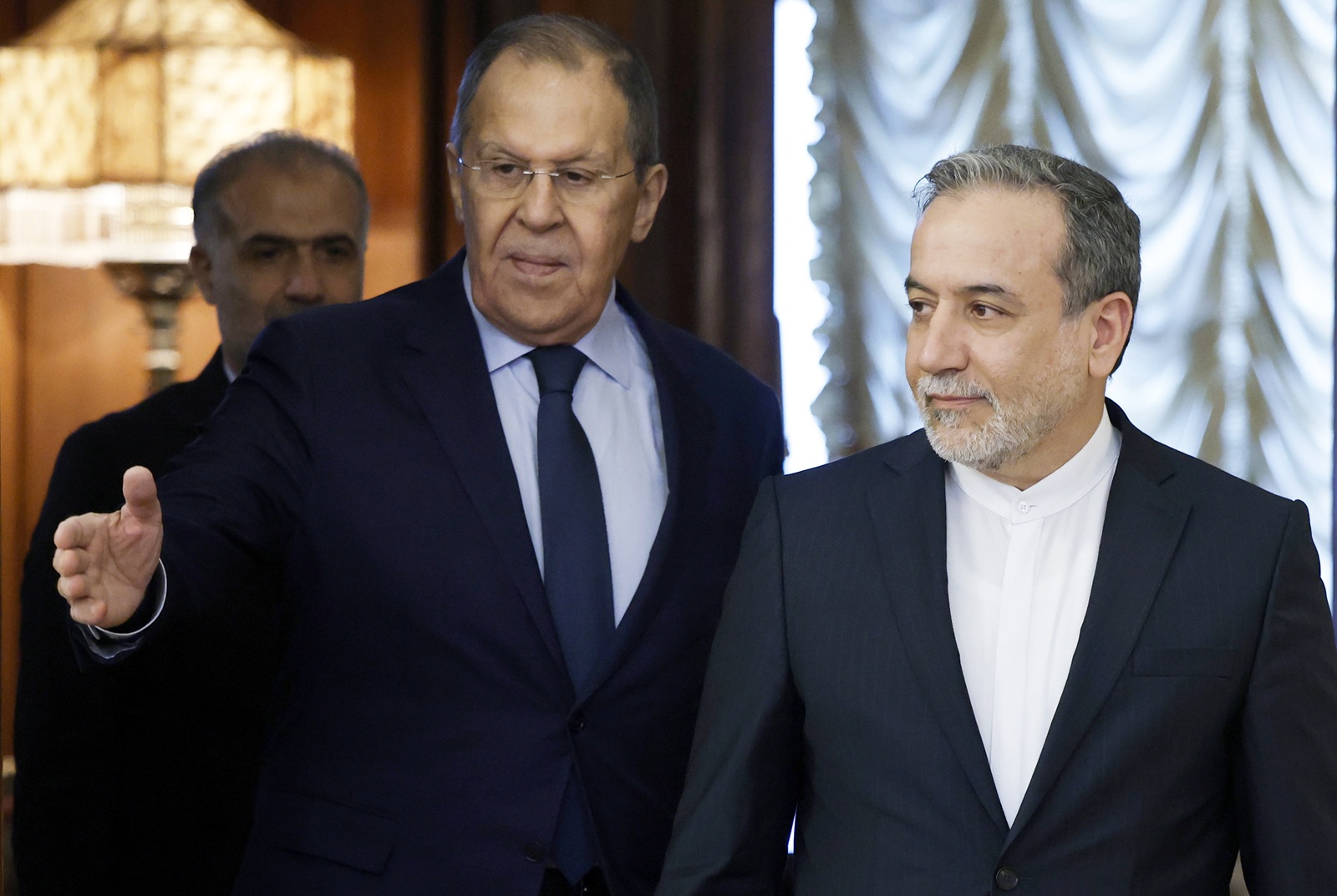 epa12038489 Russian Foreign Minister Sergei Lavrov (L) and his Iranian counterpart Abbas Araghchi enter a hall during a meeting in Moscow, Russia, 18 April 2025. Araghchi is on a two-day working visit to Moscow.  EPA/TATYANA MAKEYEVA / POOL