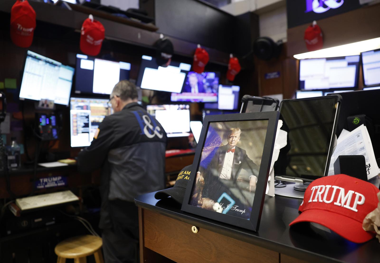 Trump Maga merchandise is present on the floor of the New York Stock Exchange as traders work on Wall Street on Thursday, April 3, 2025 in New York City. The Dow Jones Industrial Average opened today down over 1000 points as US stocks continue to be volatile due to trade-war worries from President Trump's tariffs. President Donald Trump signed an aggressive and far-reaching "reciprocal tariff" policy at the White House yesterday. Photo by John Angelillo/UPI Photo via Newscom Photo: John Angelillo/NEWSCOM