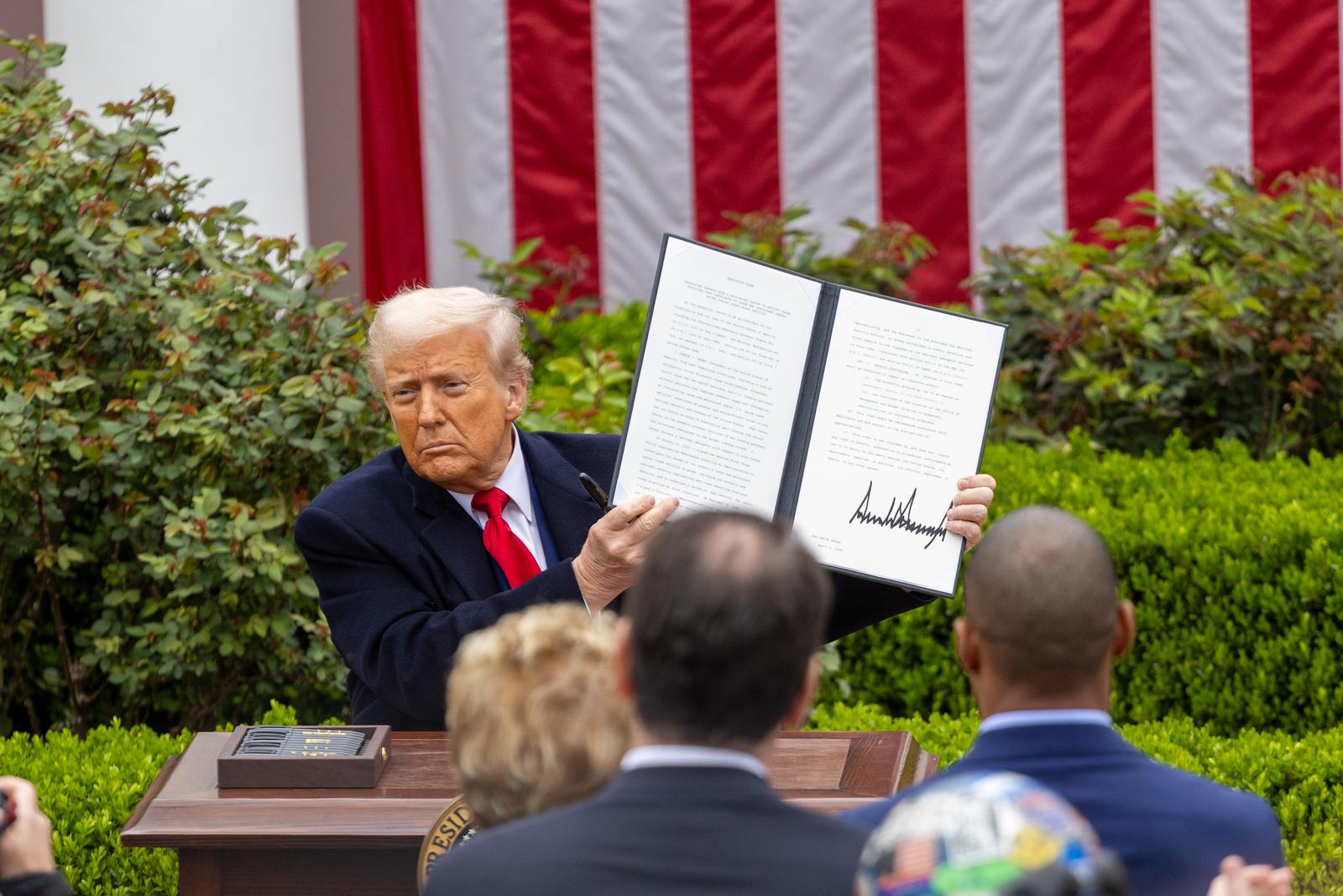 (250403) -- BEIJING, April 3, 2025 (Xinhua) -- U.S. President Donald Trump shows an executive order on "reciprocal tariffs" at the Rose Garden of the White House in Washington, D.C., the United States, on April 2, 2025.   Amid widespread opposition, U.S. President Donald Trump on Wednesday signed an executive order on the so-called "reciprocal tariffs," imposing a 10-percent "minimum baseline tariff" and higher rates on certain trading partners. (Xinhua/Hu Yousong) Photo: Hu Yousong/XINHUA