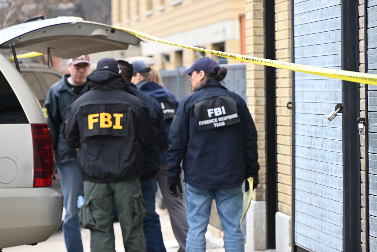 FBI agents are seen taking various evidence boxes from a warehouse to a vehicle following a double homicide in Mount Vernon. On the morning of Tuesday, March 19, 2024, an attempted robbery and shooting took place at 137 South 5th Avenue in the City of Mount Vernon, New York. One person died at the scene, and another person passed away at a local hospital. Local police, the NYPD, and the FBI are currently searching for the gunman. Police tapes are cordoning off the scene as the investigation continues throughout the morning on Wednesday to allow the evidence collection process by the FBI to be unimpeded. (Photo by Kyle Mazza / SOPA Images/Sipa USA) Photo: SOPA Images/SIPA USA