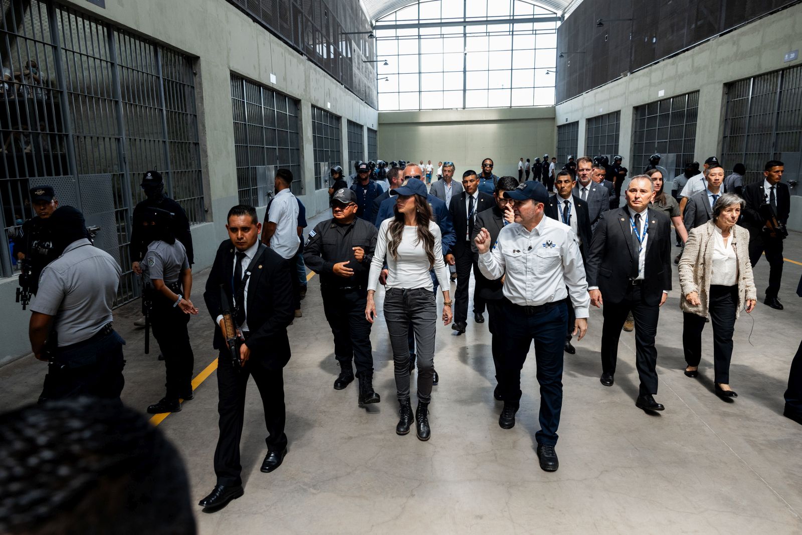 epa11990854 A handout photo made available by the Government of El Salvador shows U.S. Secretary of Homeland Security, Kristi Noem (C) touring the Center for Confinement of Terrorism (CECOT), in Tecoluca, El Salvador, 26 March 2025. Noem toured the Salvadoran maximum-security prison where more than 200 Venezuelan migrants are being held, expelled on a flight by US authorities after being accused of belonging to the transnational crime gang Tren de Aragua.  EPA/Government of El Salvador / HANDOUT EDITORIAL USE ONLY/ NO SALES/ ONLY AVAILABLE TO ILLUSTRATE THE ACCOMPANYING NEWS (MANDATORY CREDIT )HANDOUT EDITORIAL USE ONLY/NO SALES