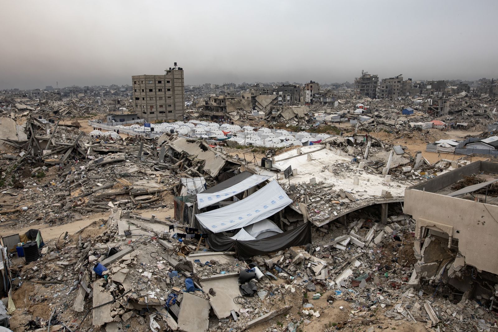 epa12018087 A camp for internally displaced Palestinians, which was set up by the HHO Foundation, is surrounded by the rubble of destroyed buildings in the Jabalia refugee camp, northern Gaza Strip, 08 April 2025. According to the UN, at least 1.9 million people (or nine in ten people) across the Gaza Strip are internally displaced, including people who have been repeatedly displaced. Since October 2023, only about 11 percent of the Gaza Strip has not been placed under Israeli-issued evacuation orders, the UN aid coordination office OCHA said.  EPA/HAITHAM IMAD
