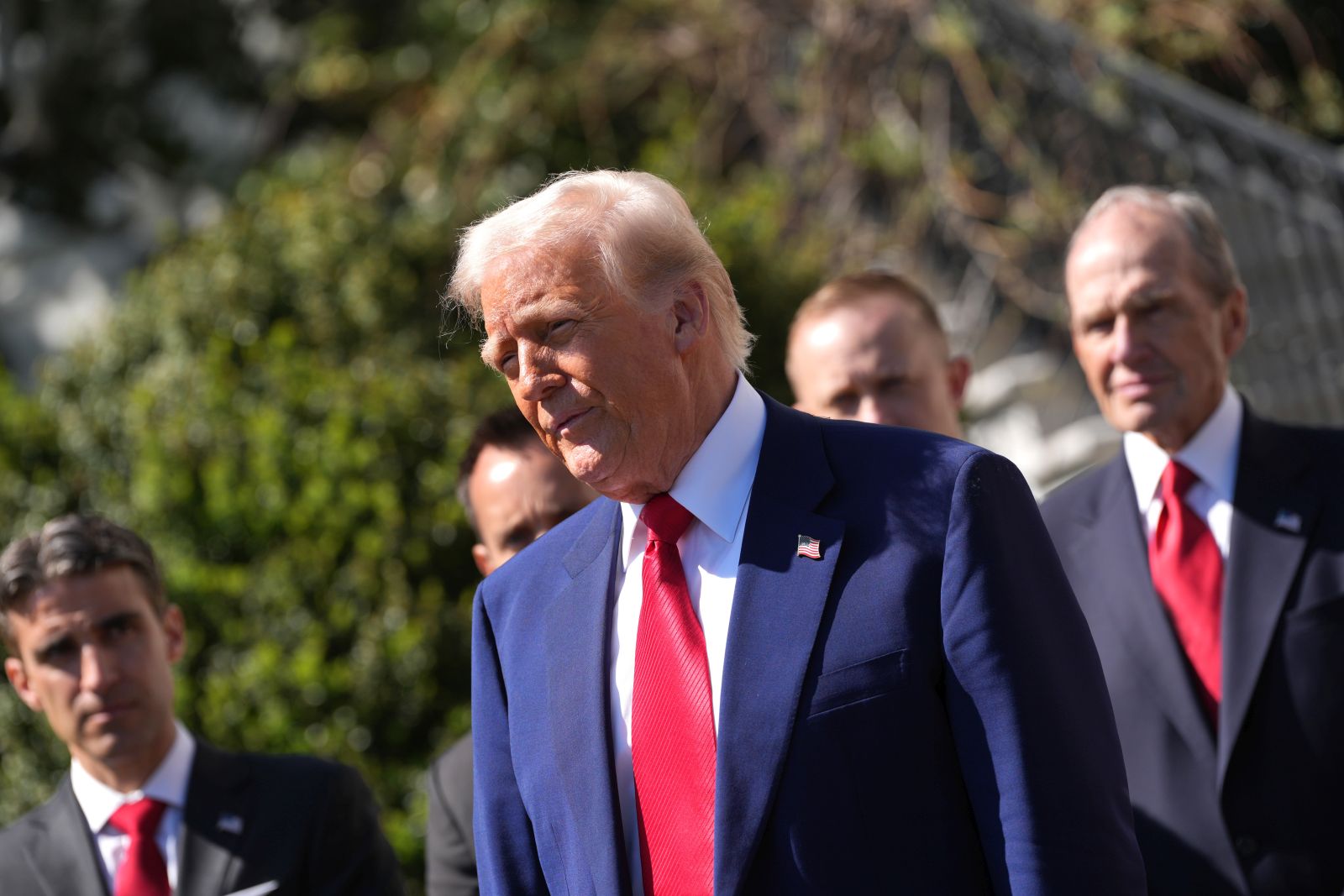 epa12021439 US President Donald Trump speaks as he participates in a photo opportunity with racing champions outside the White House in Washington, DC, USA, 09 April 2025.  EPA/CHRIS KLEPONIS /POOL