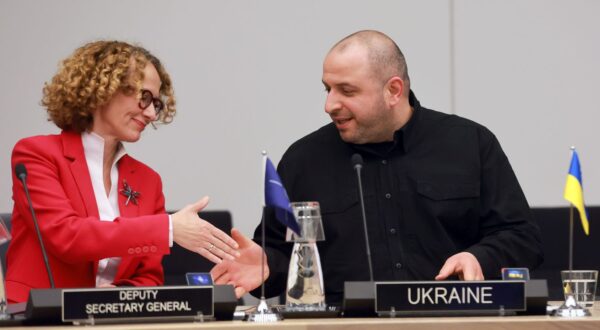 epa12022647 NATO Deputy Secretary General Radmila Shekerinska (L) and Ukrainian Defense Minister Rustem Umerov shake hands prior to a meeting of he Coalition of the Willing Defence Ministers for Ukraine at NATO Headquarters in Brussels, Belgium, 10 April 2025.  EPA/OLIVIER HOSLET