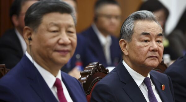 epa12031625 Chinese President Xi Jinping (L) and Foreign Minister Wang Yi attend a meeting with Vietnam's National Assembly Chairman Tran Thanh Man (not pictured) during his visit in Hanoi, Vietnam, 14 April 2025. The Chinese president is on a state visit to Vietnam from 14 to 15 April 2025.  EPA/Athit Perawongmetha / POOL