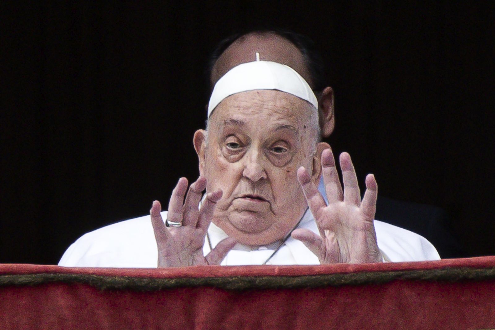 epa12042353 Pope Francis gestures during the Urbi et Orbi blessing following the Easter Mass in Saint Peter's Square, in Vatican City, 20 April 2025.  EPA/ANGELO CARCONI