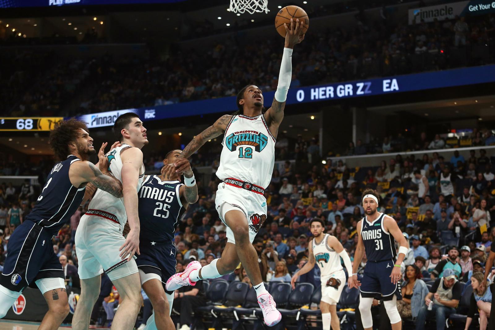 Apr 18, 2025; Memphis, Tennessee, USA; Memphis Grizzlies guard Ja Morant (12) drives to the basket during the third quarter against the Dallas Mavericks at FedExForum. Mandatory Credit: Petre Thomas-Imagn Images/Sipa USA Photo: Imagn Images/SIPA USA