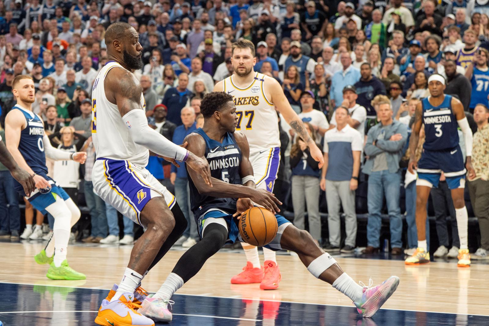 Apr 27, 2025; Minneapolis, Minnesota, USA; Minnesota Timberwolves guard Anthony Edwards (5) is fouled by Los Angeles Lakers forward LeBron James (23) in the fourth quarter during game four of first round for the 2025 NBA Playoffs at Target Center. Mandatory Credit: Matt Blewett-Imagn Images/Sipa USA Photo: Imagn Images/SIPA USA