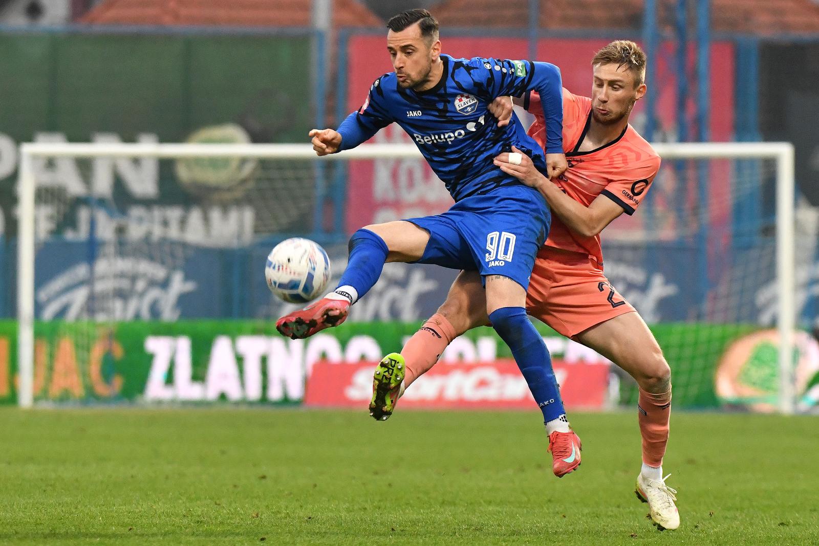 02.04.2025., Gradski stadion "Ivan Kusek Apas", Koprivnica - SuperSport Hrvatski nogometni kup 2024./25., polufinale, NK Slaven Belupo - NK Osijek. Ilija Nestorovski i Luka Jelenic Photo: Vjeran Zganec Rogulja/PIXSELL